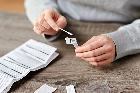 woman-making-self-testing-coronavirus-test-home.jpg